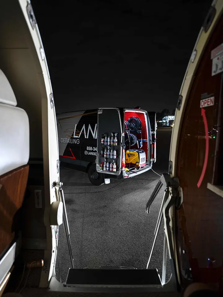 View from the aircraft doorway to the stocked Lanix detailing van