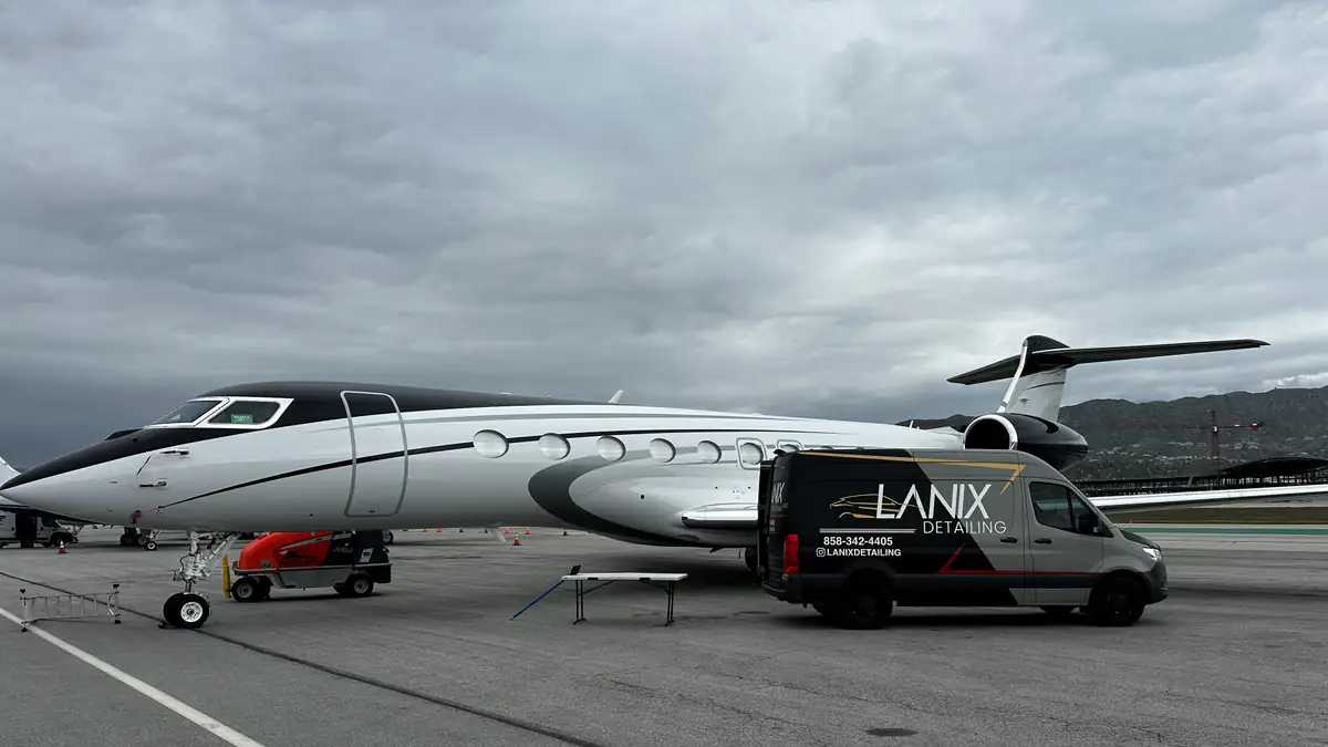 Business jet exterior detail on the ramp beside the Lanix van