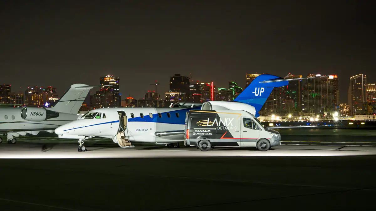 Jet and Lanix van against the San Diego skyline at night